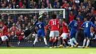 One word, commitment. De Gea lunges to save Everton's last gasp effort. He had already denied them from the spot once.